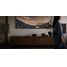 onkyo-muse80th-01_on-long-media-console-beside-speakers-with-grilles-on-stands-and-woman-walking-in-blurred-foreground-v02_2000x1000